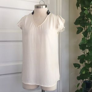 Anthropologie HD Paris cream blouse with trim neck